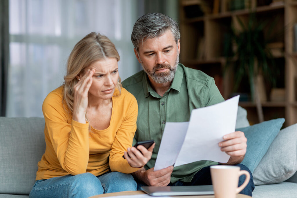 Couple Looking At Paperwork